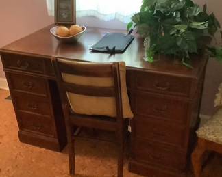 Oak desk with several drawers, with chair.  