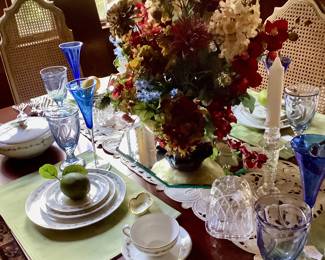 Another picture of table and has 4 cane back, newly upholstered  seats in blue and beige.