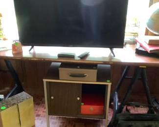 Tv in office and a larger TV in den.  Both flat screens.