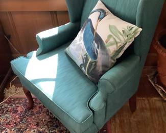 Close-up of the wing back chair with one of the birds.