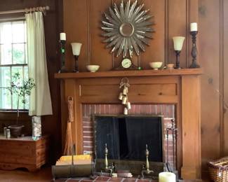 Full view with firewood and tools for starting a fire.