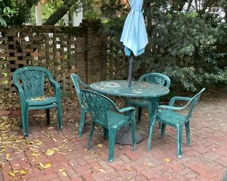 Table and chairs with umbrella.   Has matching foot stools.
