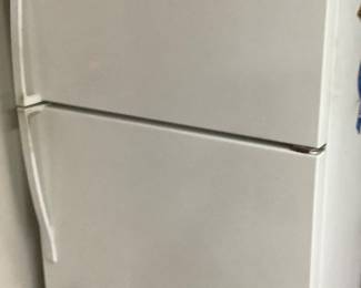 Refrigerator with freezer top and ice maker.