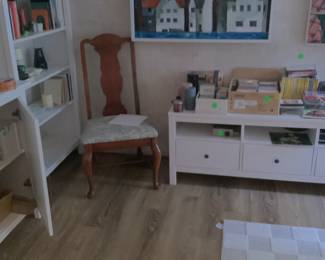 White bookcase with items.