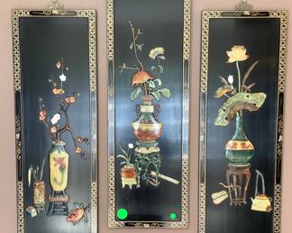 The oriental wall hangings.