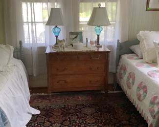 The walnut chest with the blue crystal lamps, I was telling you about.