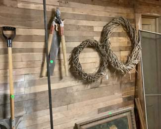 Wreaths and yard tools.