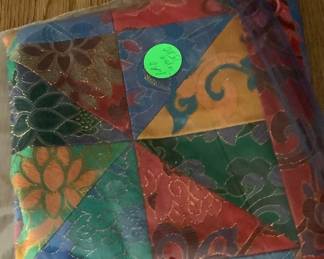 Gorgeous piece of sewen fabric in bright colors.