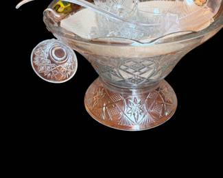 Several punch bowls with cups