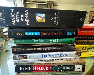 Stack of Assorted Used Books and DVDs