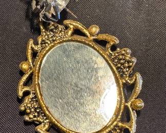 $25, Gold-Tone Ornate Openwork Floral Cabochon Mirror, Pendant