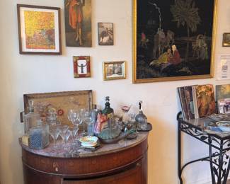 Demilune Cabinet Bar Setup with Assorted Glassware and Framed Art Collection