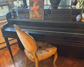 Dark Wood Upright Piano with Turned Legs and Decorative Music Desk