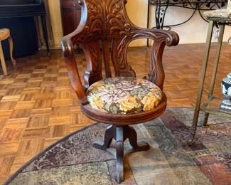 $1200, Renaissance Revival Carved Wood Swivel Ornate Arm Chair with Wrought Iron Base