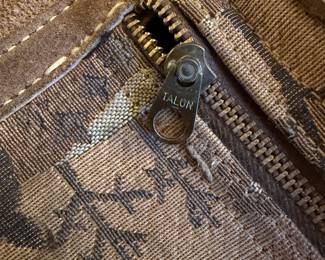 Brass Talon Zipper Detail on Suede Garment with Woven Patterned Lining