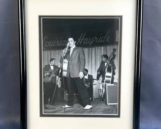 Collectors Copy Photograph Of Elvis Presley Performing At The 1956 Louisiana Hayride With His Original Band Members, Scotty Moore, Bill Black, And D.J. Fontana, Framed And Matted Under Glass, Approx 15” x 11.5” 