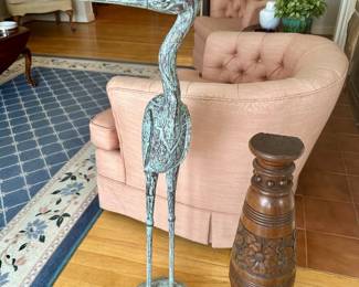Wood crane and antique carved wood decor.
