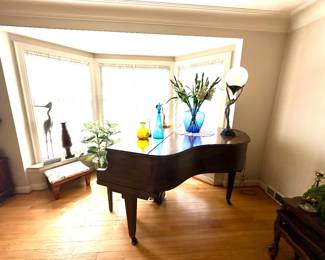Vintage Wurlitzer baby grand piano.
