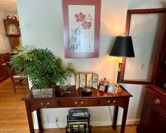 Console table with Asian decor.