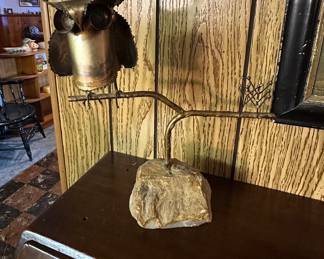Curtis Jere own on branch with stone base.