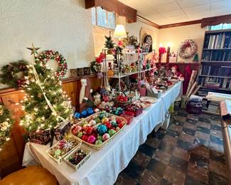 Two tables full of Christmas and holiday.
