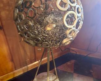 Metal birds nest sculpture.