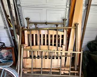 Antique brass beds and wood twin bed.