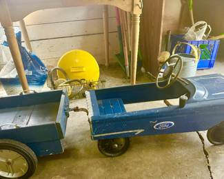 Metal petal car with handmade trailer.