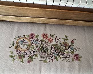 Needlepoint piano bench.