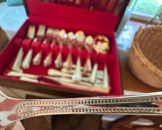 Full set of Community silver-plate flatware.