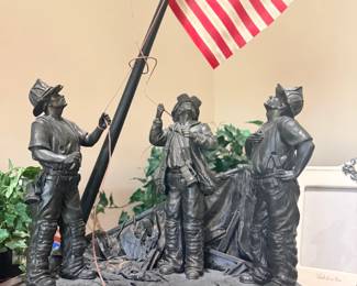 Firemen raising flag 