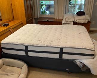 H7 - $350. Thomasville Wood Bed Frame with Mirrored Back. Measures 108.25 W by 18 D by 78 T. 