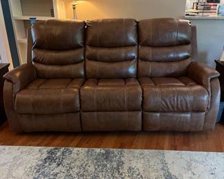 H103 - $650 Each. *2 Available* Ashley Brown Furniture Power Recline "Leather" Couches. Measures 84" W x 38" D x 41" T.  19.5 floor to seat height. Leather blend - it's 46% Leather, 37% PUC, 17% Polyester. Both are in very good condition. One has marks on the head rest (see photo)