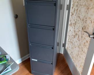 H38 - $20. Metal 4 Drawer Filing Cabinet. Measures 15 W by 27.75 W by 49.75 T 