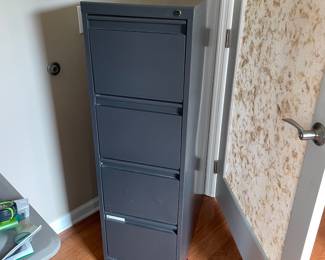 H38 - $20. Metal 4 Drawer Filing Cabinet. Measures 15 W by 27.75 W by 49.75 T 