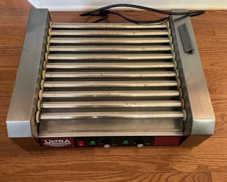 H17 - $100. Ultra Dawg Commercial Hot Dog Roller. Model 4094. 11 Rollers. Also has glass cover. 