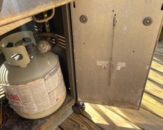 H9 - $125. Weber Genesis Grill includes propane tank. Measures 56 W by 26 D by 48 T 