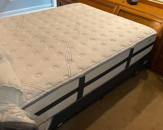 H7 - $350. Thomasville Wood Bed Frame with Mirrored Back. Measures 108.25 W by 18 D by 78 T. 