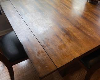 H104 - $450. Dining room Table set manufactured by Latitude Tree Furniture. Includes 4 chairs and bench set. Table Measures 77.5 W by 40 D by 30 T. Chairs measure at 19.5 W by 21 D by 40.25 T, Seat Height  is 18 T.  Bench measures 64 W by 16 D by 18 T.  Table top has some signs of wear and love but very sturdy and a great set!