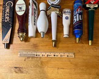 H84 - $90. Variety of Beer pull handles. Yuengling, Red Oak (has damage), Ginger's Revenge,  Bowling Pin, Modelo, Labatt Bleu, Dos Equis, Worsteiner. 