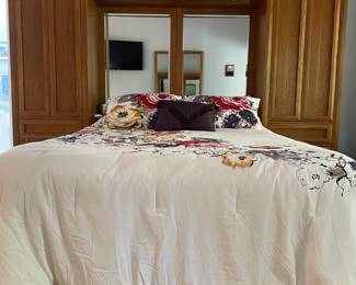 H7 - $350. Thomasville Wood Bed Frame with Mirrored Back. Measures 108.25 W by 18 D by 78 T. 