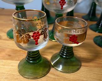 H51 - $75. 14 Pc. Vintage German Roemer Grape Vine. Gold Rimmed glasses. Beehive stem. 3" tall, 3.5" tall, 4.5" tall, 5.5" tall. ALL have noticeable wear on the gold trim. 