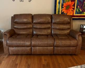 H103 - $650 Each. *2 Available* Ashley Brown Furniture Power Recline "Leather" Couches. Measures 84" W x 38" D x 41" T.  19.5 floor to seat height. Leather blend - it's 46% Leather, 37% PUC, 17% Polyester. Both are in very good condition. One has marks on the head rest (see photo)