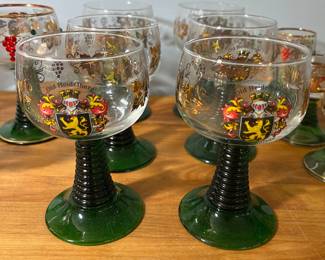 H51 - $75. 14 Pc. Vintage German Roemer Grape Vine. Gold Rimmed glasses. Beehive stem. 3" tall, 3.5" tall, 4.5" tall, 5.5" tall. ALL have noticeable wear on the gold trim. 