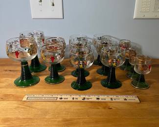 H51 - $75. 14 Pc. Vintage German Roemer Grape Vine. Gold Rimmed glasses. Beehive stem. 3" tall, 3.5" tall, 4.5" tall, 5.5" tall. ALL have noticeable wear on the gold trim. 