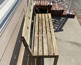 H27 - $50. Outdoor Wooden Bench. Measures at 48 W x 18 D x 33.25 T.