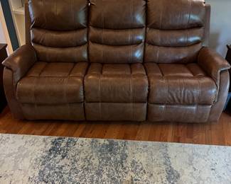 H103 - $650 Each. *2 Available* Ashley Brown Furniture Power Recline "Leather" Couches. Measures 84" W x 38" D x 41" T.  19.5 floor to seat height. Leather blend - it's 46% Leather, 37% PUC, 17% Polyester. Both are in very good condition. One has marks on the head rest (see photo)