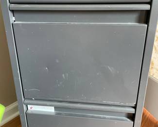 H38 - $20. Metal 4 Drawer Filing Cabinet. Measures 15 W by 27.75 W by 49.75 T 