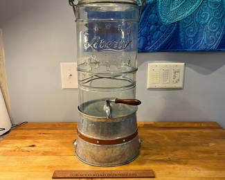 H78 - $65. Large VTG Liberty glass drink Dispenser 2.5 Gallon with stand. Measures 8" D x 15.5" T 