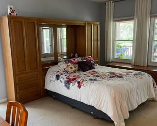 H7 - $350. Thomasville Wood Bed Frame with Mirrored Back. Measures 108.25 W by 18 D by 78 T. 